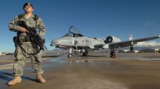 Senior Airman Mario Fajardo stands guard while on duty Jan. 25 at Davis-Monthan Air Force Base. 355th Security Force squadron is responsible for the worldwide force protection and security of seven flying squadrons and 4,400 tactical and stored aircraft on Davis-Monthan AFB worth more than 32.3 billion dollars. Airman Fajardo is with the 355th Security Forces Squadron. (U.S. Air Force photo/Airman 1st Class Melissa Copeland)